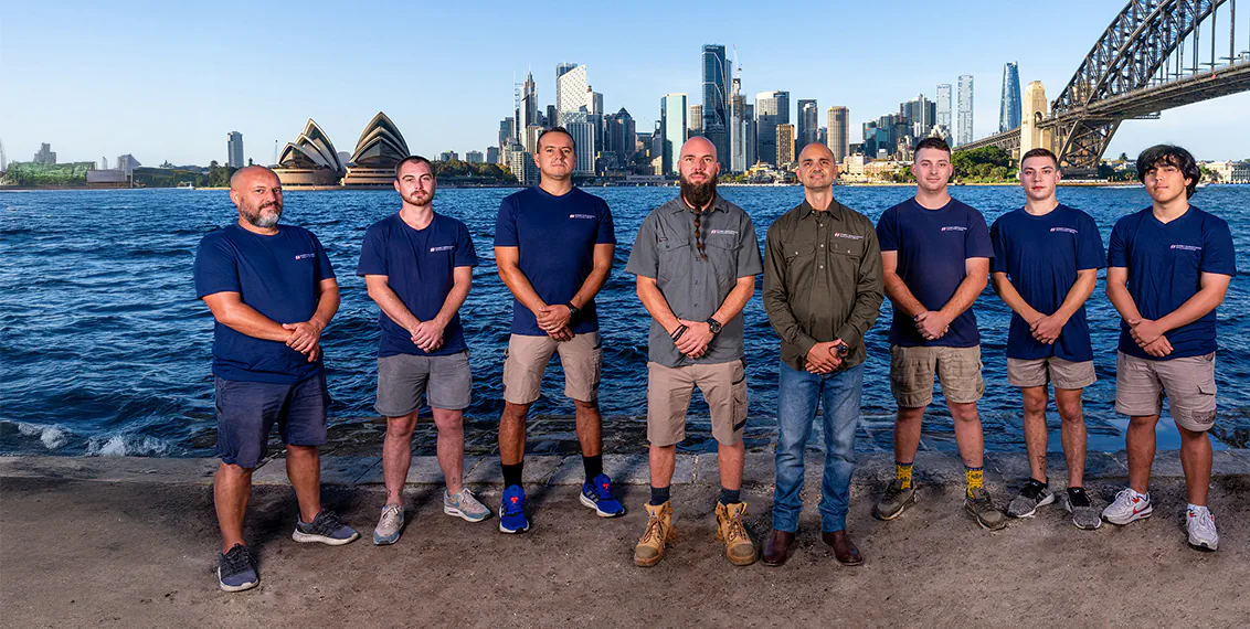 The team from Sydney Rangehoods in front of the Sydney Harbour Bridge