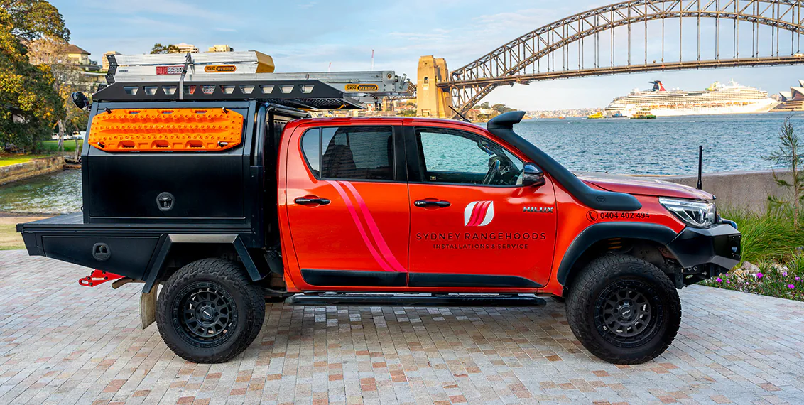 The Sydney Rangehoods service truck in front of the Sydney Harbour Bridge