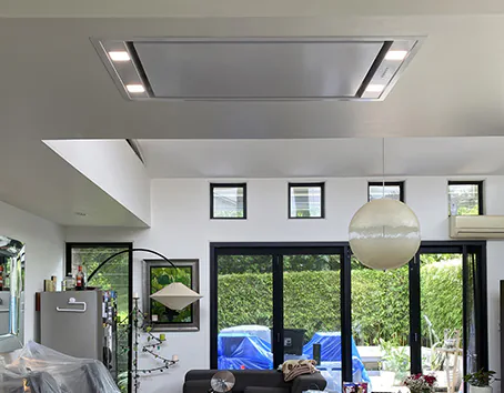 A nice stainless steel ceiling-mounted cassette rangehood in a modern home