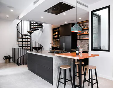 A beautiful modern black ceiling cassette style rangehood, providing a sleek and efficient ventilation solution