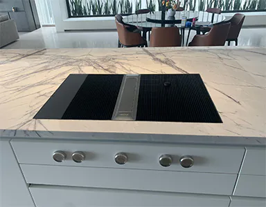 A sleek black Bora downdraft rangehood, designed for efficient ventilation and modern aesthetics in the kitchen