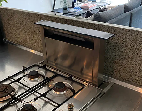 A compact and stylish example of a downdraught range hood from one of our projects