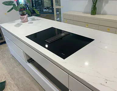 A new black Miele downdraft rangehood, providing a sleek and efficient ventilation solution for modern kitchens