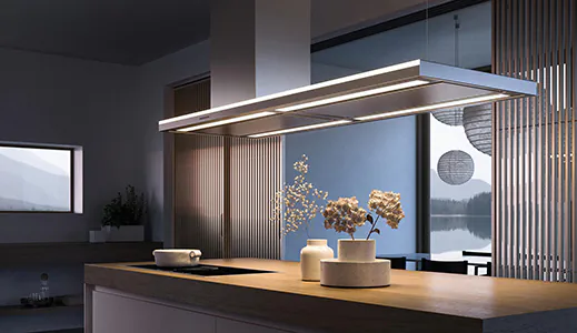 A masterpiece island rangehood that's super sleek and modern, serving as a focal point in the kitchen