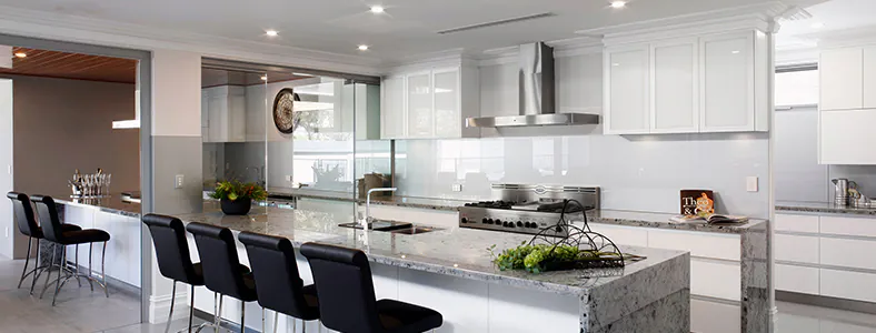 A modern stainless wall mounted rangehood in a stylish kitchen, providing efficient ventilation and sleek design