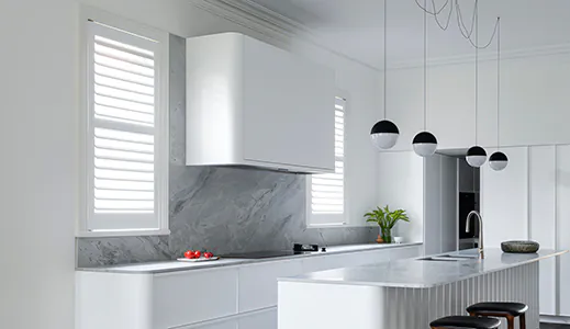 A new wall mounted white Qasair rangehood perfectly matching the decor of a modern kitchen