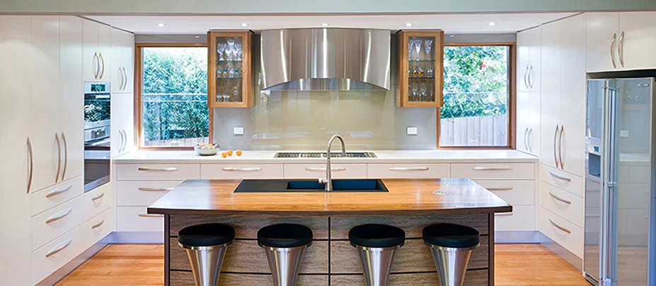 A white Qasair wall-mounted rangehood in a modern kitchen