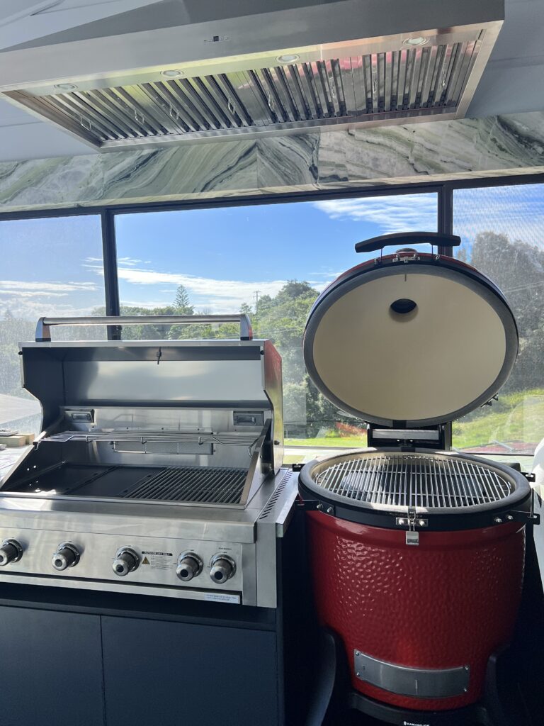 Frontal shot of Schweigen BBQ Rangehood installed in Forster's alfresco kitchen.