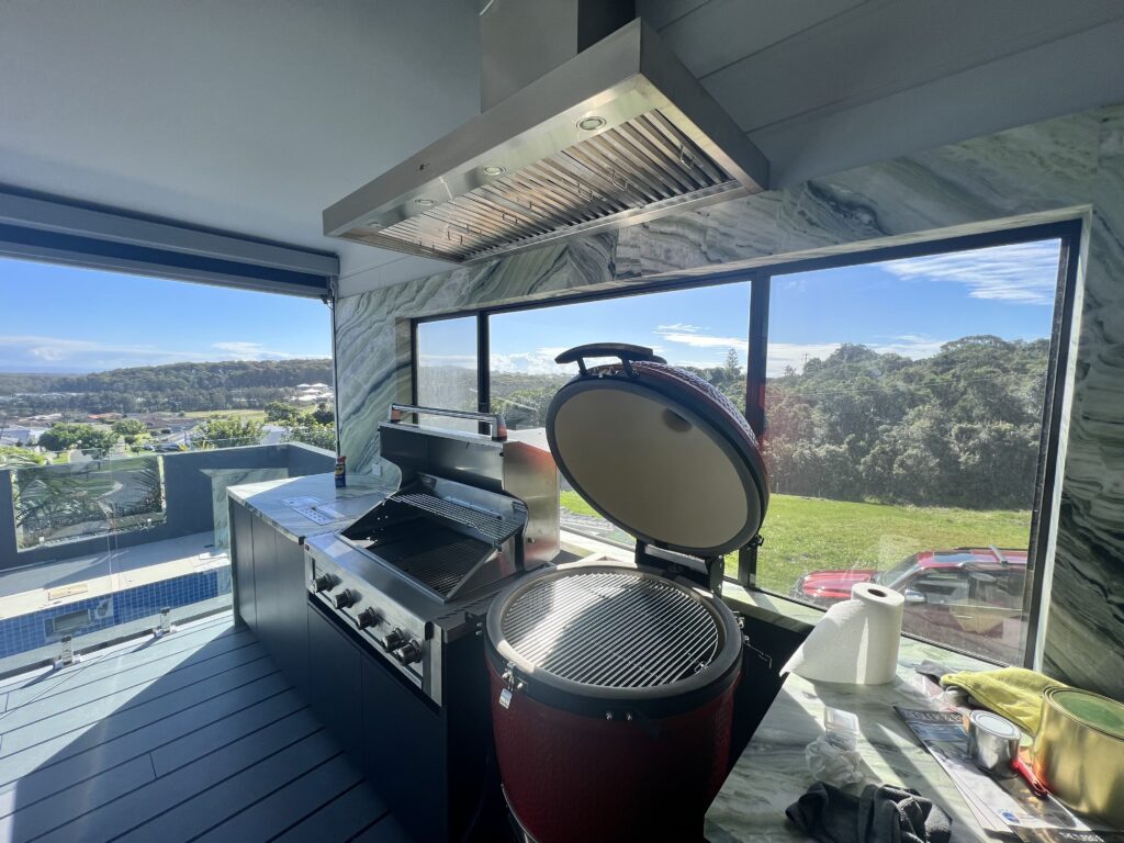 Zoomed-in shot from the right side of the Schweigen Rangehood, emphasizing its features.